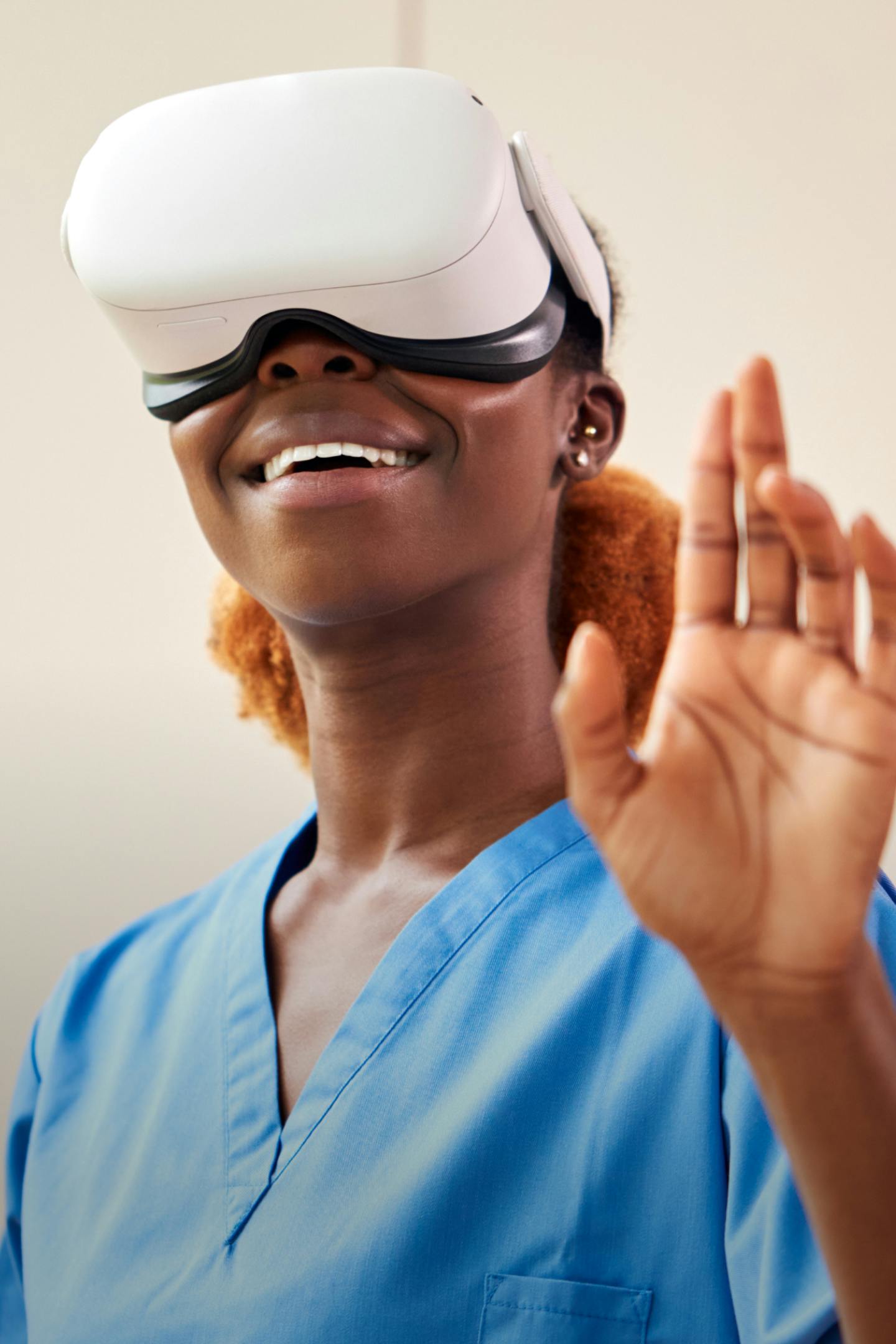 Photo of a nurse smiling using a VR headset