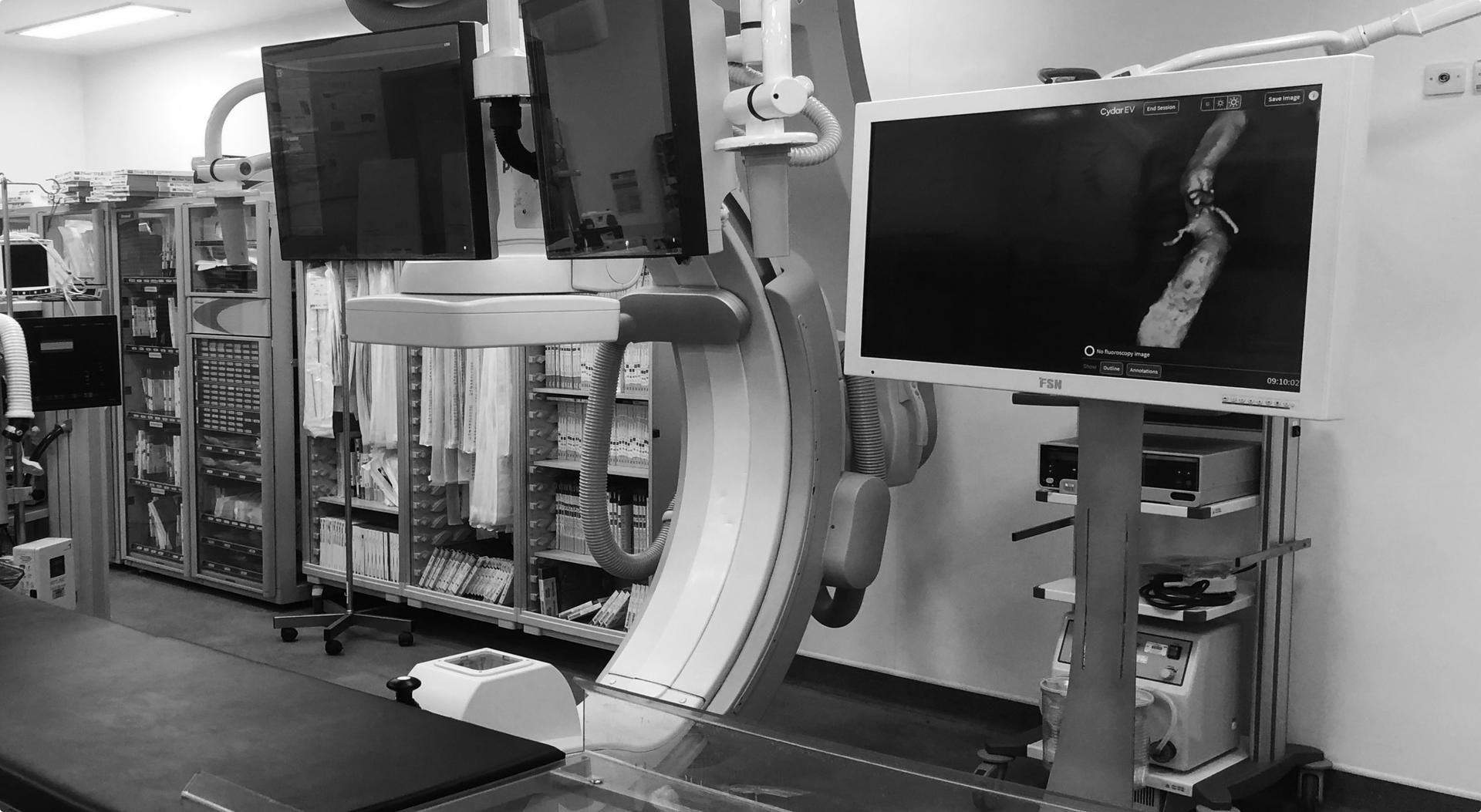 Black and white photo of screens and monitors for observing keyhole surgery