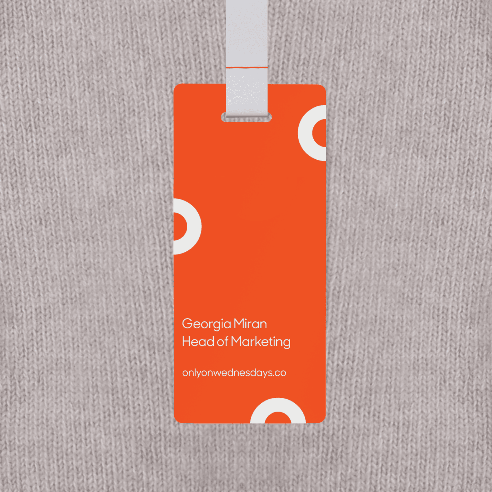 A close up on a Only on Wednesdays branded name tag A close up on a Only on Wednesdays branded name tag