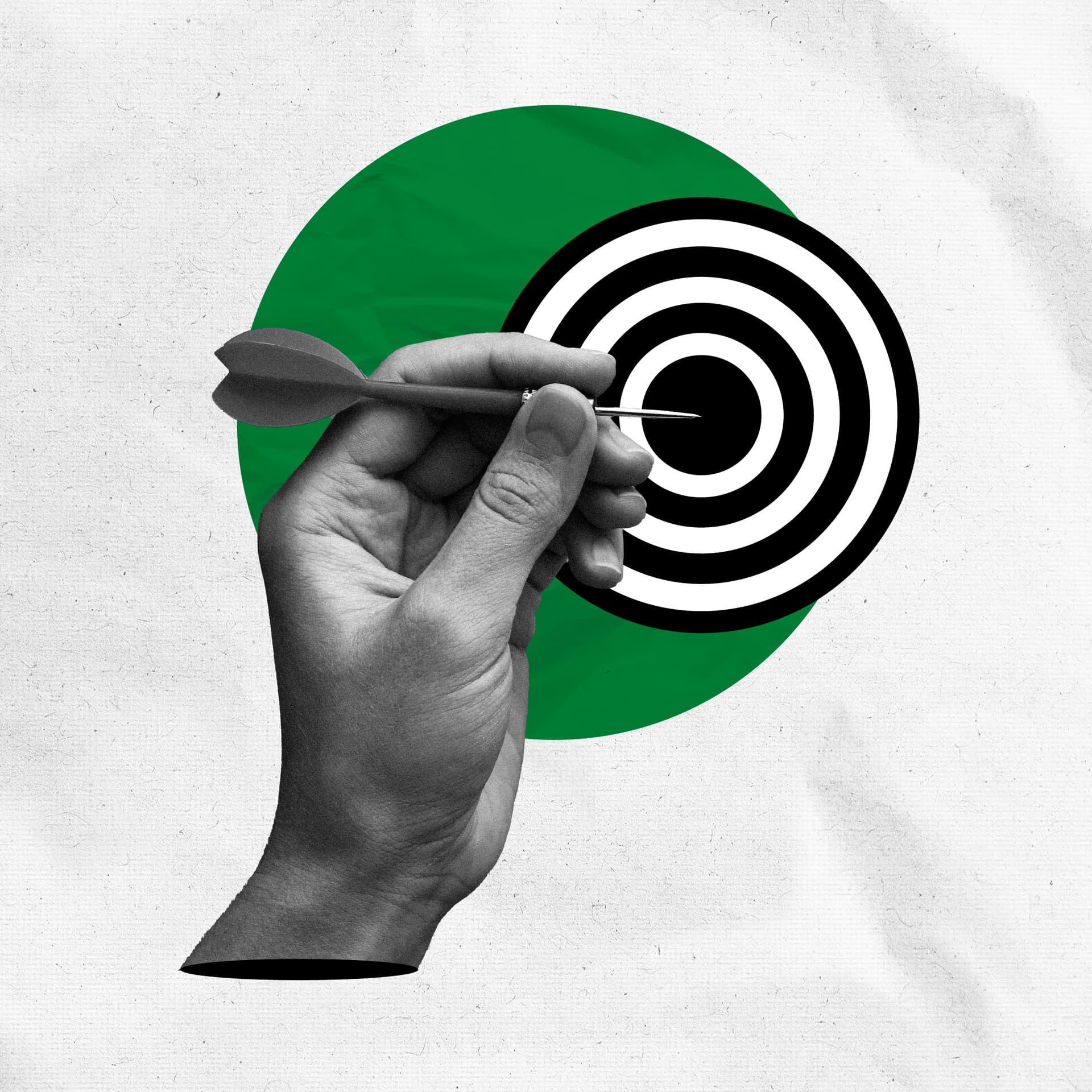 Someone holding a dart in front of a bullseye Someone holding a dart in front of a bullseye
