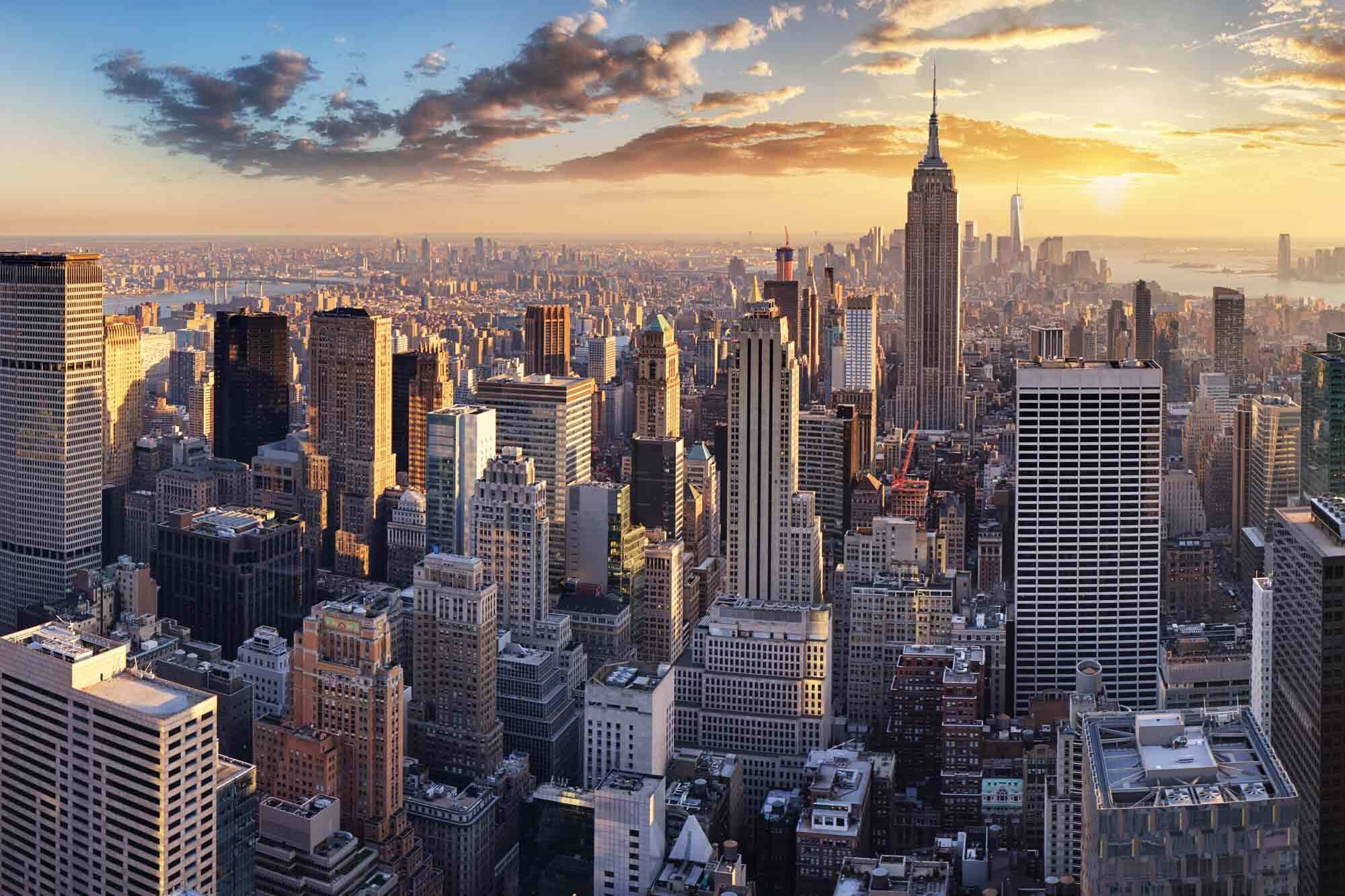 A sunset photo of the New York skyline. A sunset photo of the New York skyline.