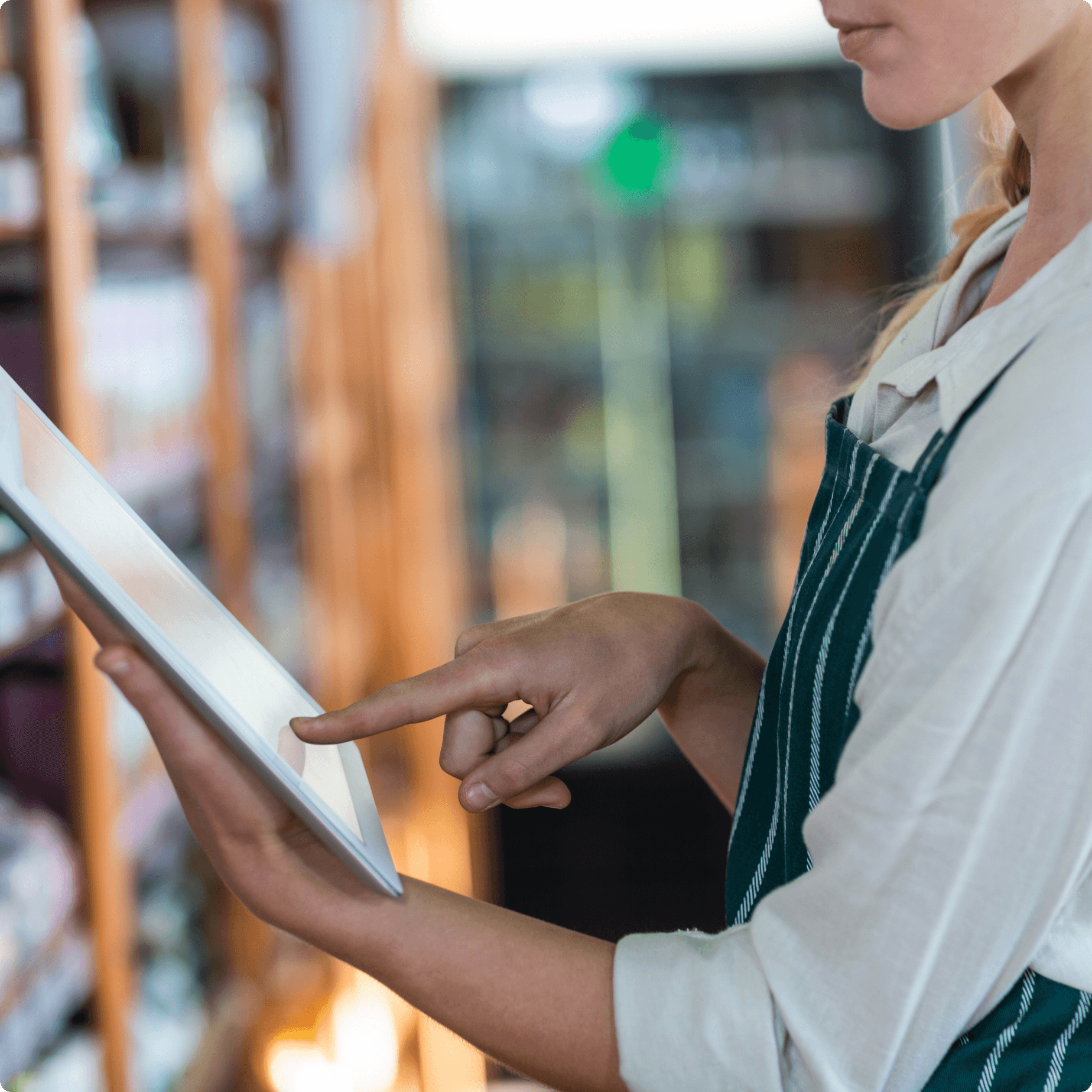 A person using a device in store to pick an item. A person using a device in store to pick an item.