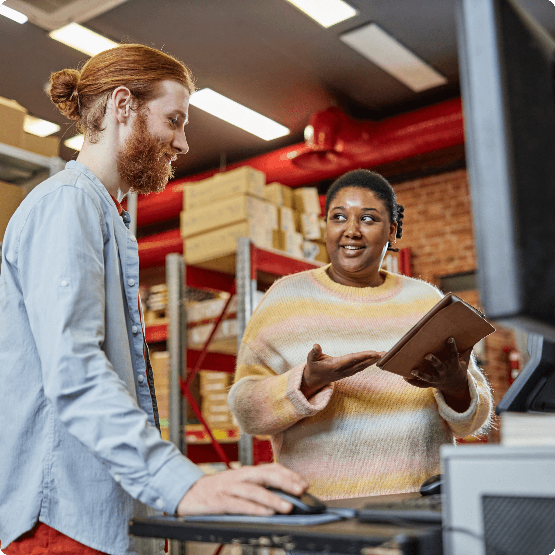 Two people talking on a shop floor.  Two people talking on a shop floor.