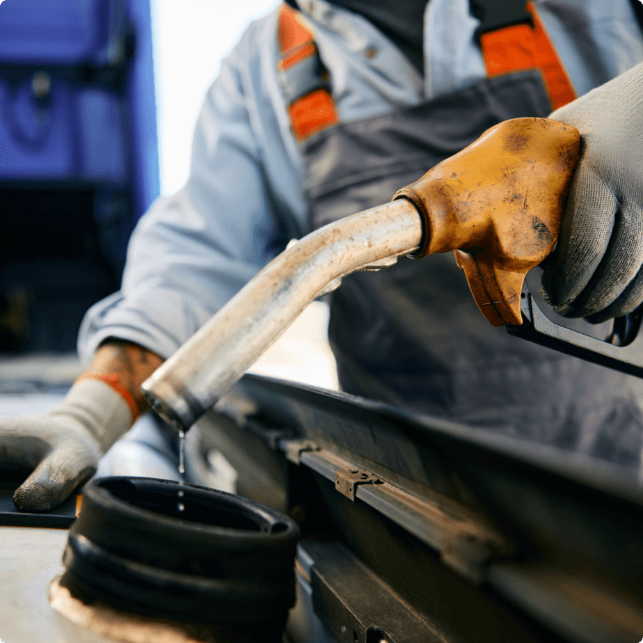 Close up view of fuel being poured into a car Close up view of fuel being poured into a car