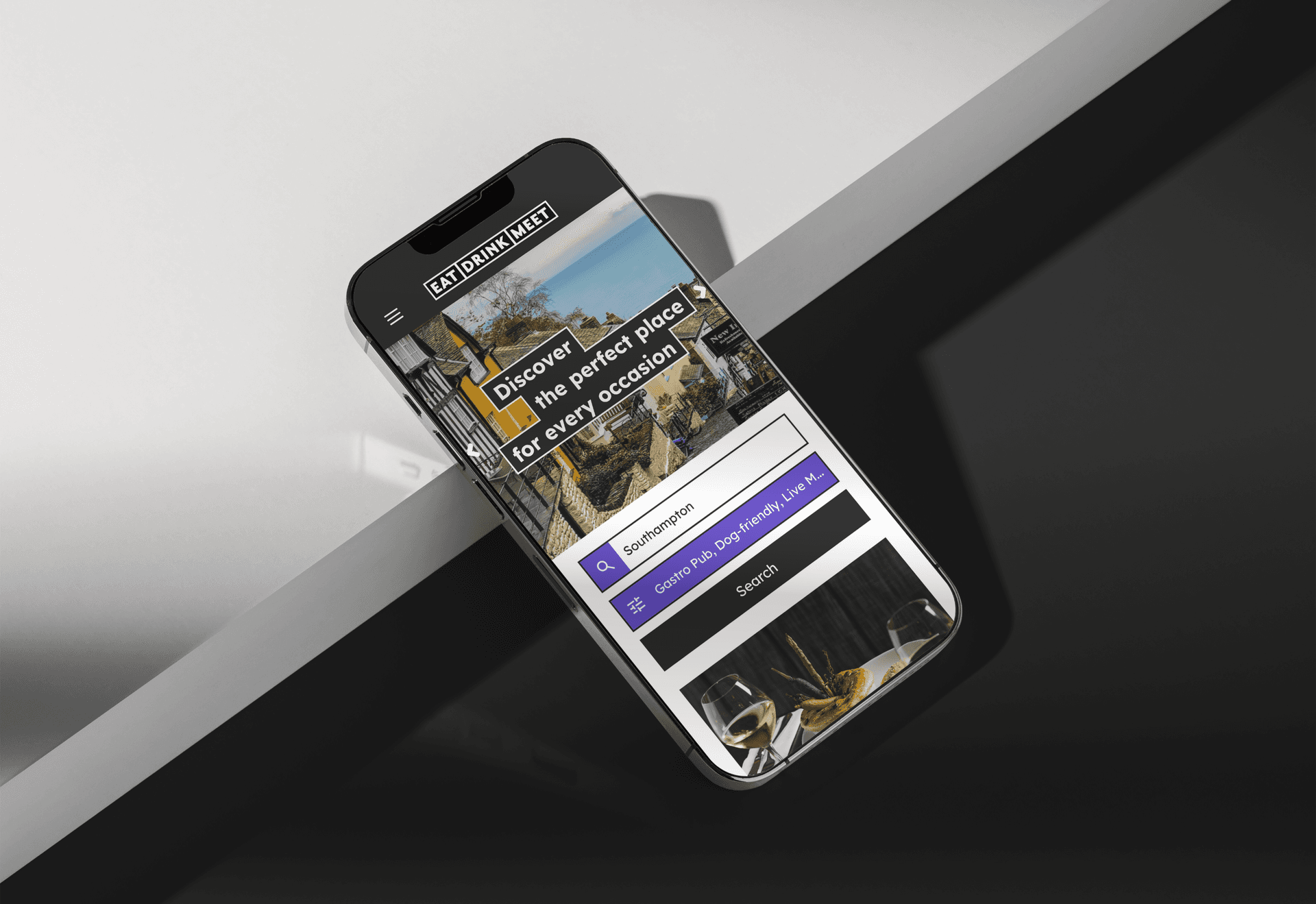 A mobile device perched on a table. A mobile device perched on a table.
