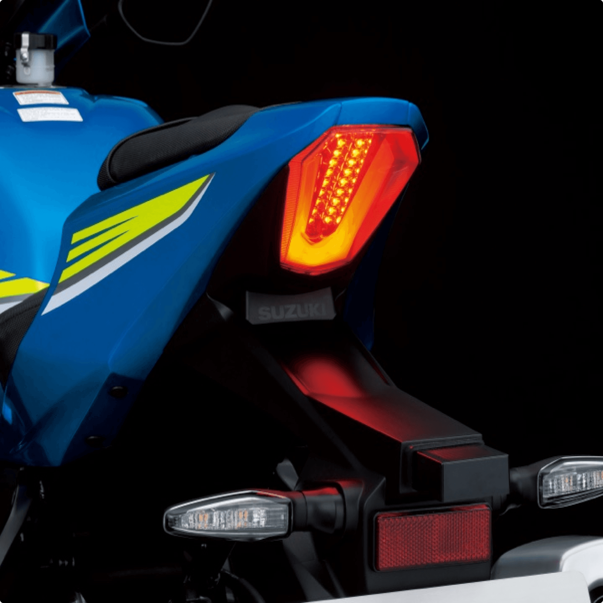The back wheel and break light of a motorcycle. The back wheel and break light of a motorcycle.