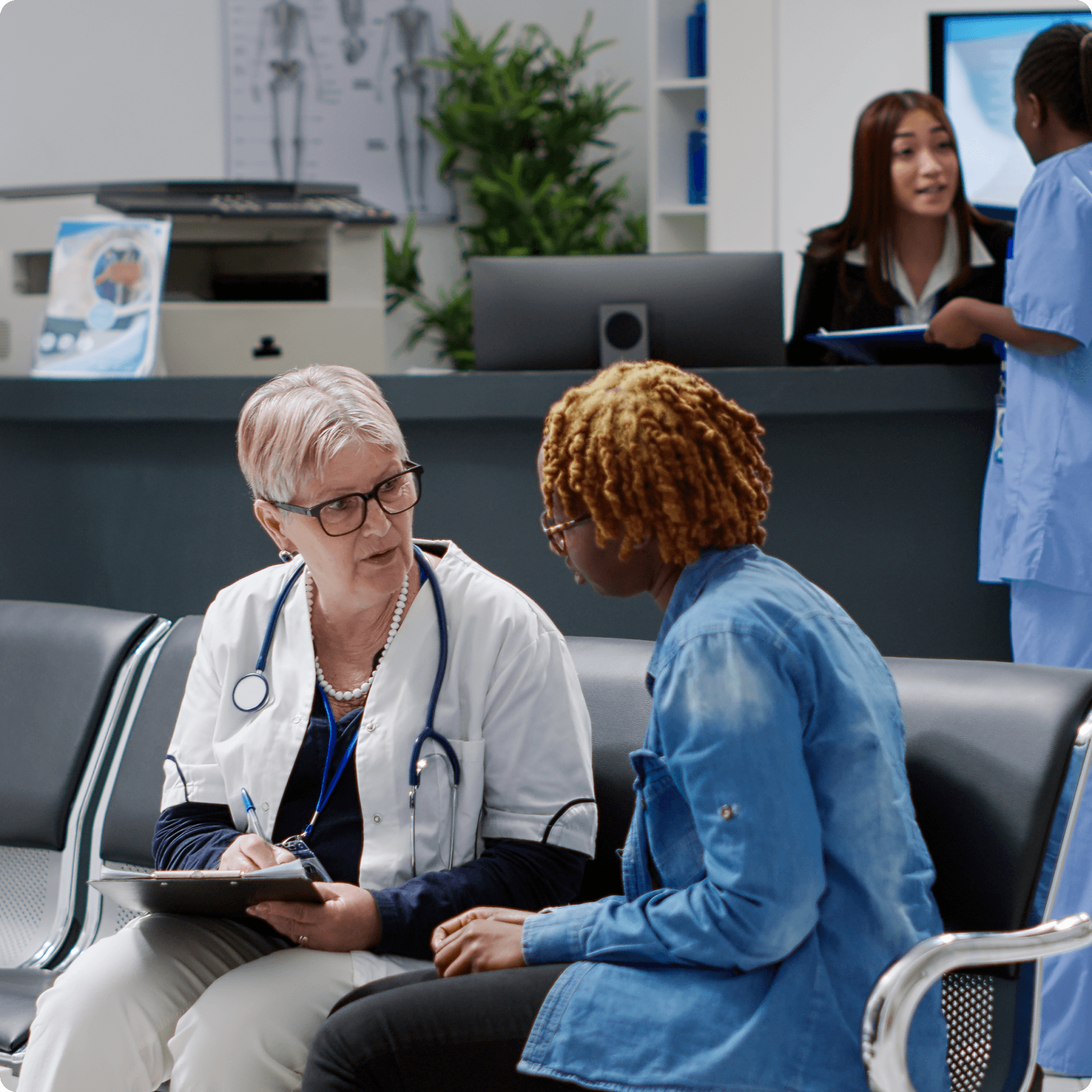 A medical professional is interacting with a patient, both are seated. A medical professional is interacting with a patient, both are seated.