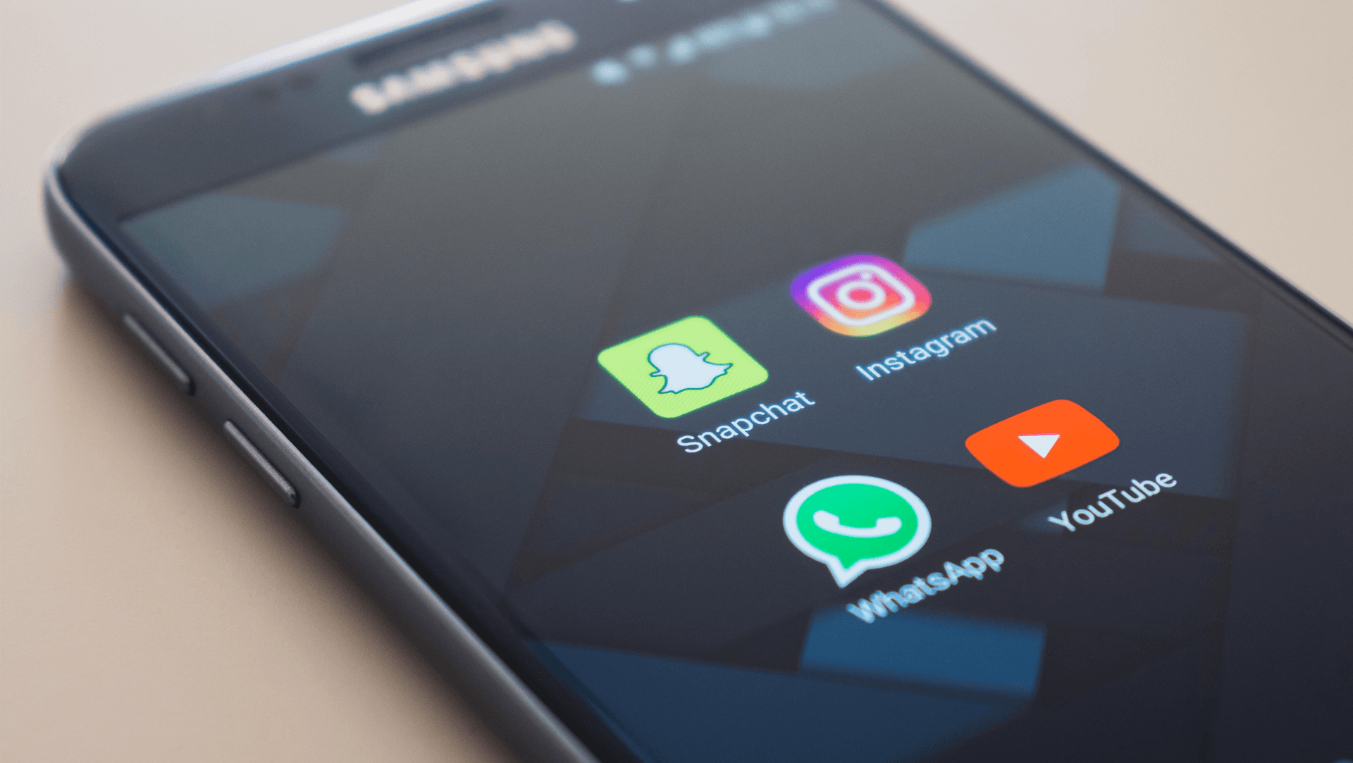 Icons of Snapchat, Instagram, WhatsApp and YouTube on a Samsung smartphone Icons of Snapchat, Instagram, WhatsApp and YouTube on a Samsung smartphone