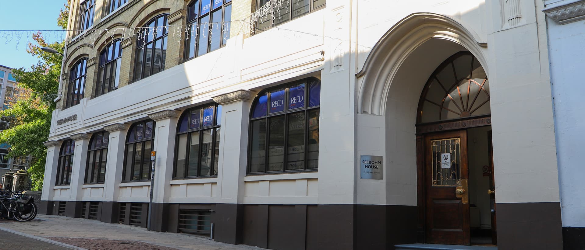 A large building, painted cream and brown, with a large doorway. This is the outside of the Foolproof Norwich office. A large building, painted cream and brown, with a large doorway. This is the outside of the Foolproof Norwich office.